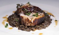 Rabbit loin with sage and rosemary, braised lentils